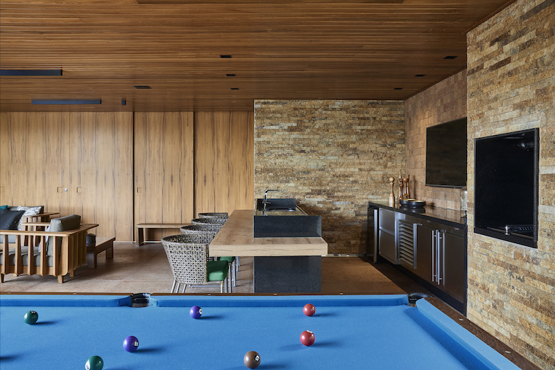 There are numerous entertainment spaces such a home theater or this relaxation area which has a pool table