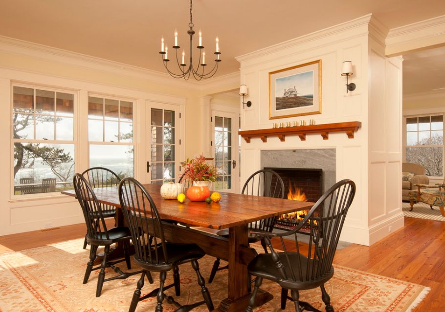 Victorian dining area in front of fireplace with trestle table