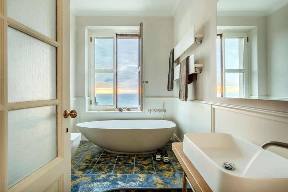 Villa freestanding tub and modern floor tiles