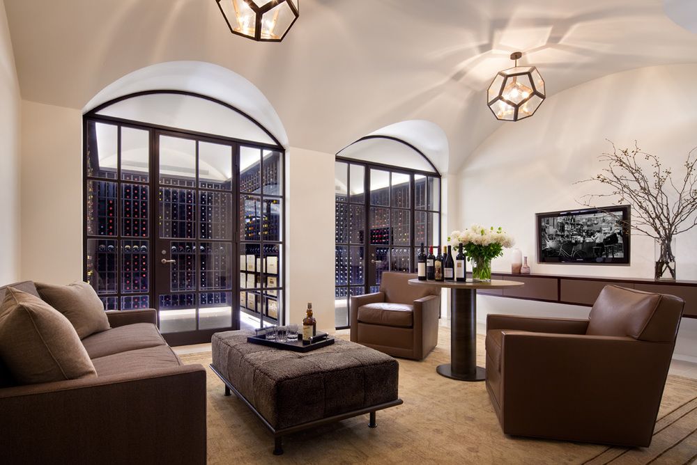 The home's indescribably gorgeous wine cellar and tasting room are inviting, while making the wine collection as special as a piece of art.