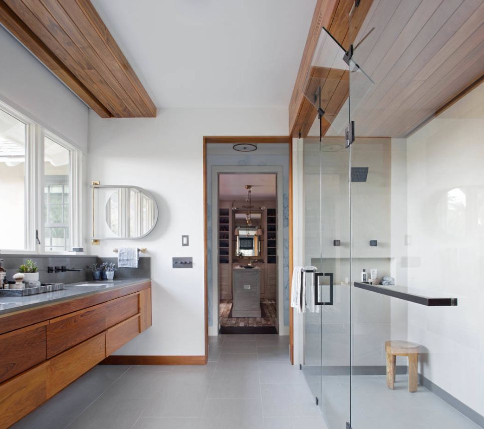 Big windows along the bathroom vanity let in a great deal of natural light.