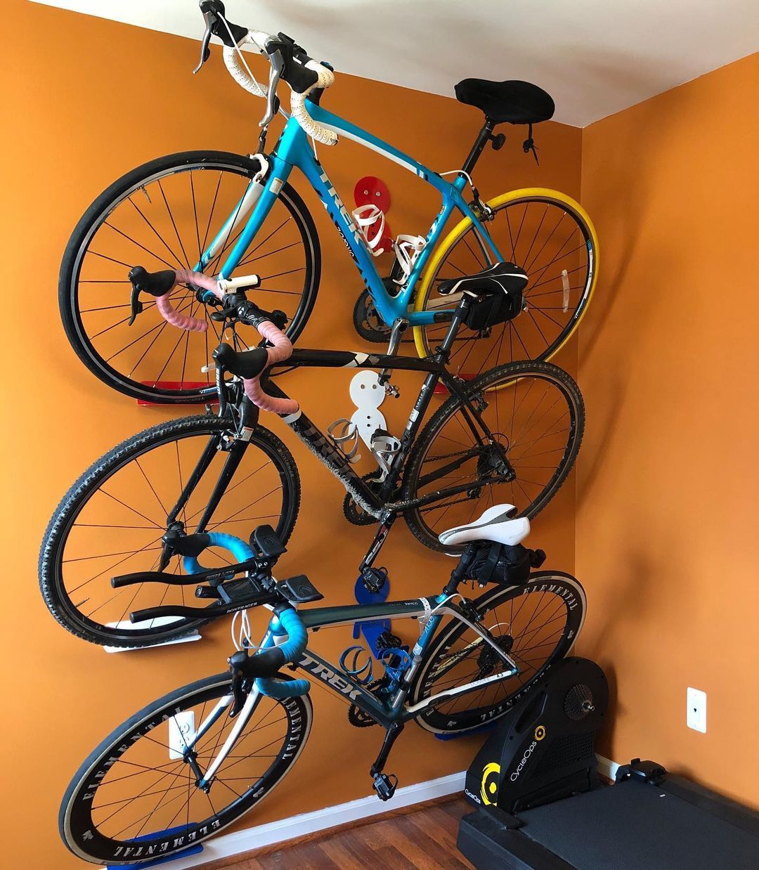 Wall-mounted bike pedal hooks