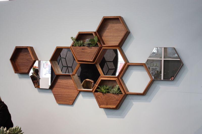 Think Fabricate's Wall-Nuts are a really fun concept. You can artfully arrange the different hexagons on the wall, according to whatever modules you want: shelving, mirrors, planters, etc.