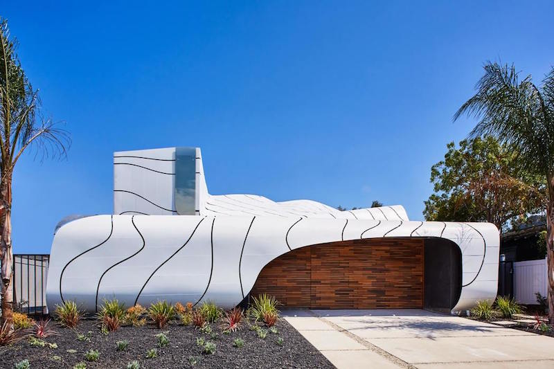 A House With An Artistic Design Inspired By Waves And Feathers