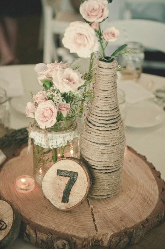 Wedding table centerpiece with wrapped twine bottle