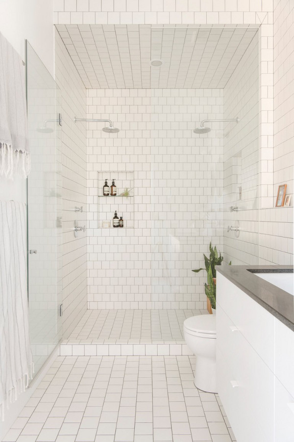 White bathroom design with a small shower niche