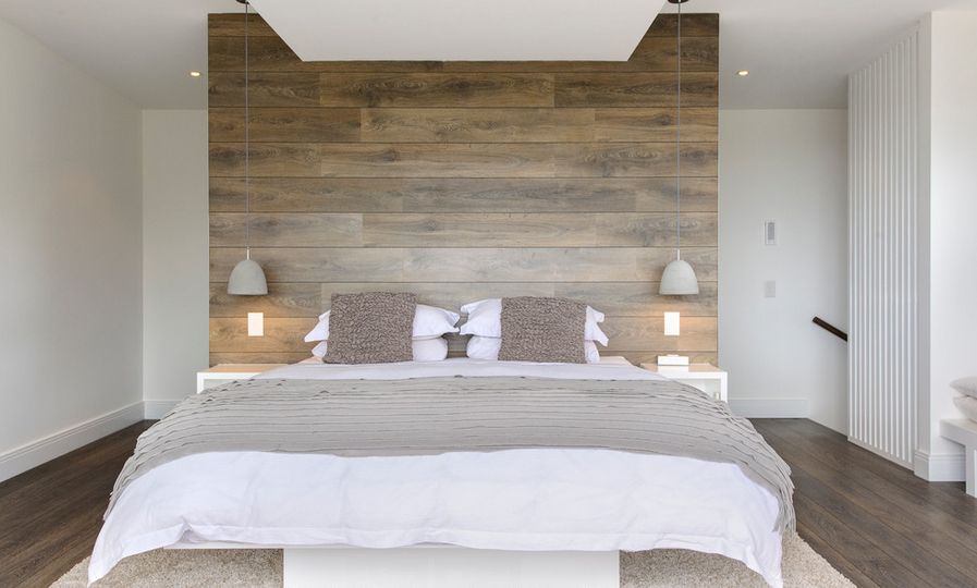 White bedroom with wooden headboard