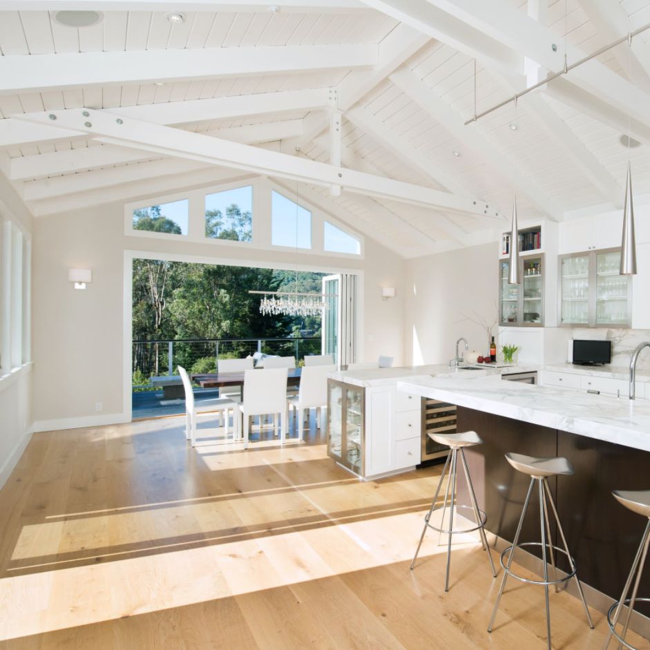 White cathedral ceiling for open kitchen