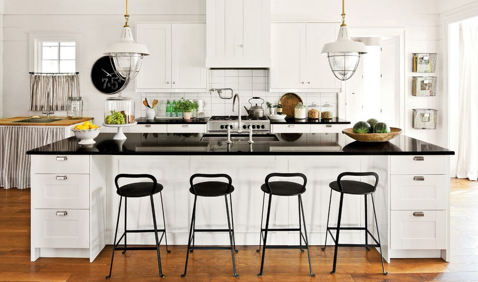 White farmhouse kitchen with black stools