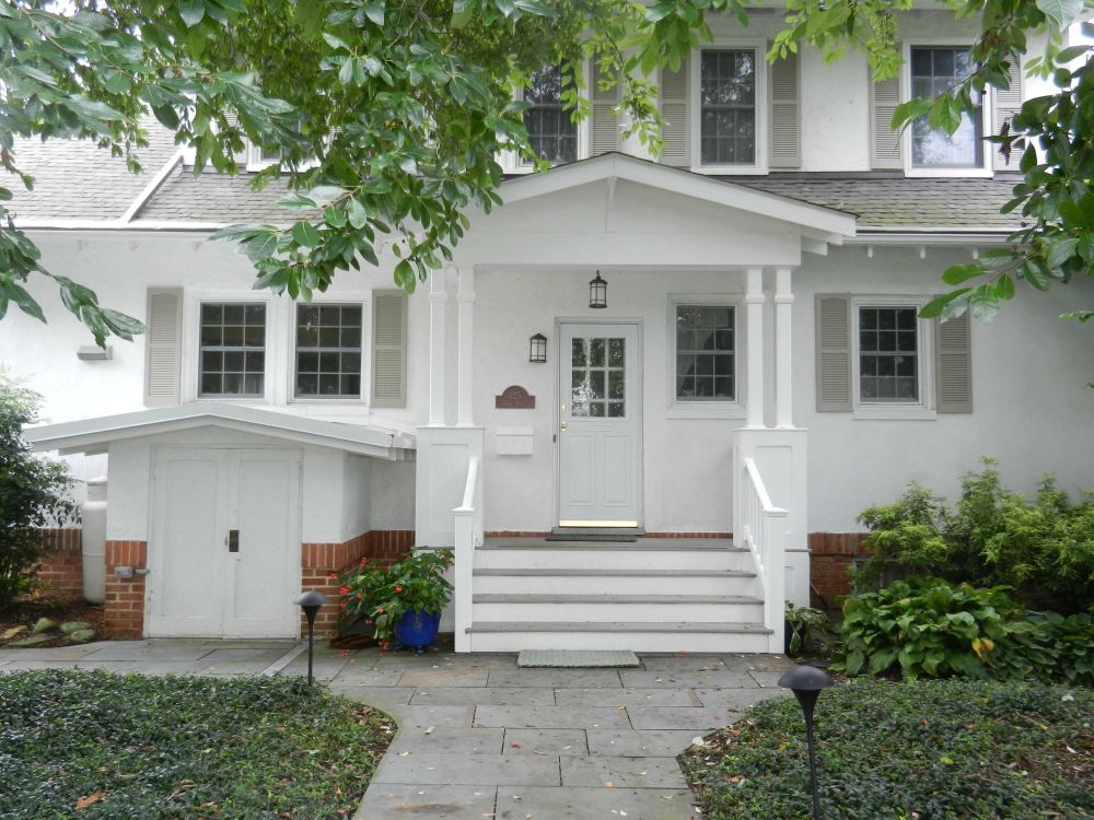 White house facade with a small porch