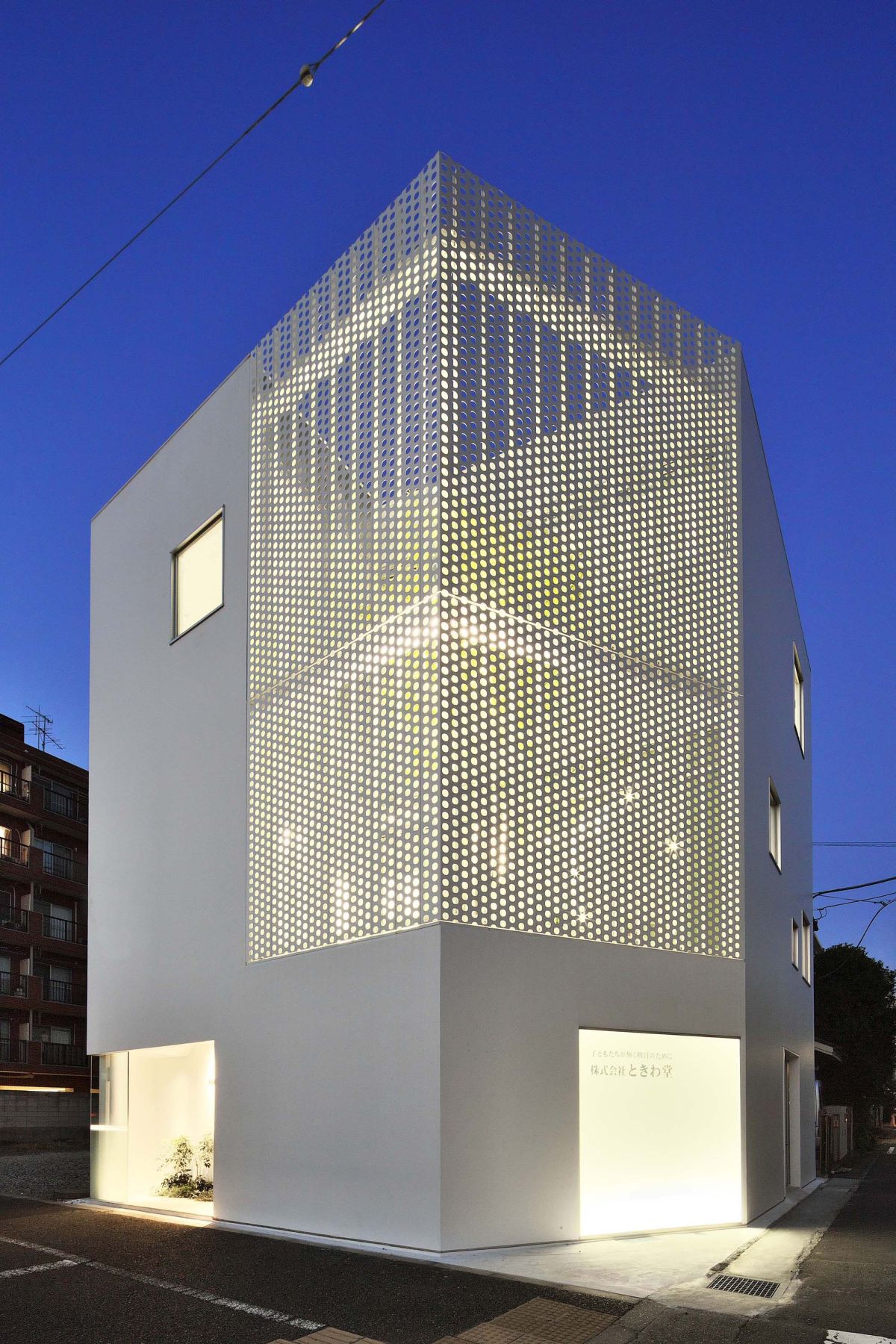 White house with a perforated facade