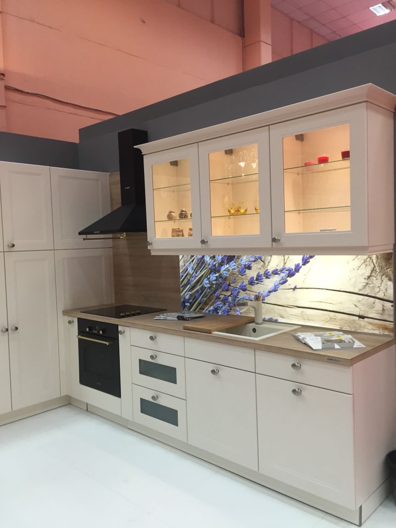 White kitchen design with Glass door cabinets