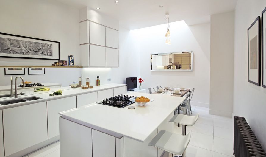 White kitchen design with dining area