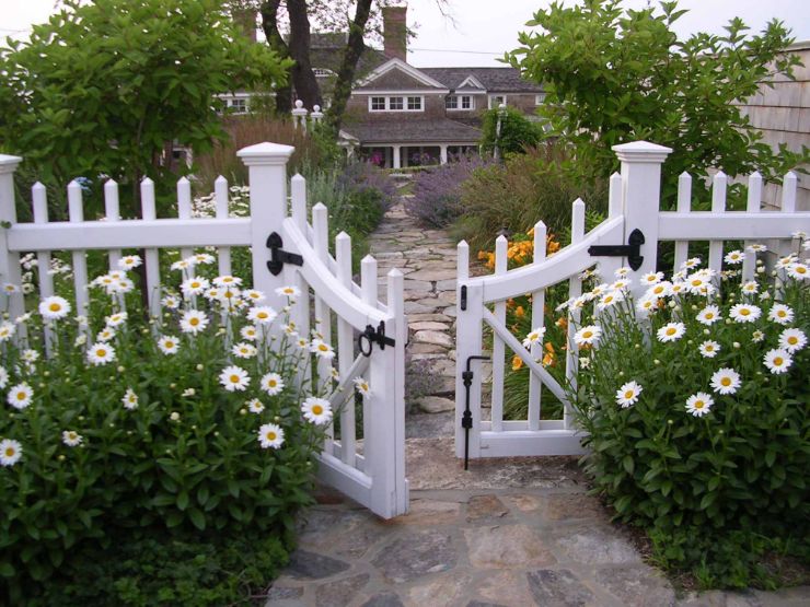 White picket fence with gate for backyard