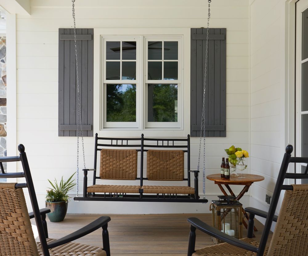 White porch design with swing chair