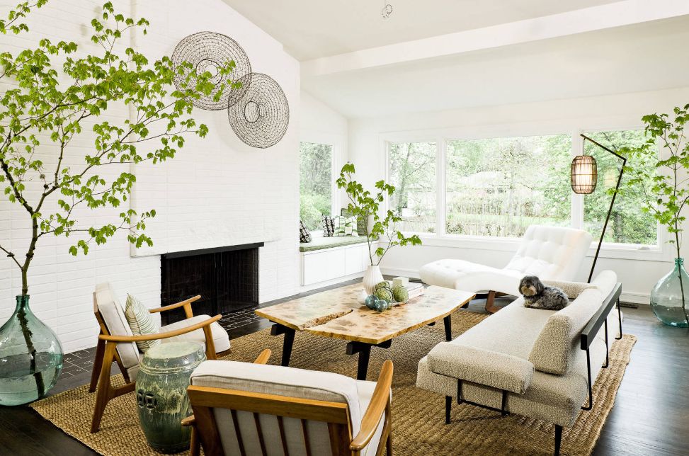 White serene living room with painted bricks and live edge coffee table