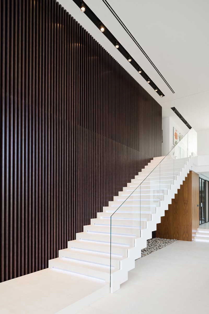 White stairs with glass handrail