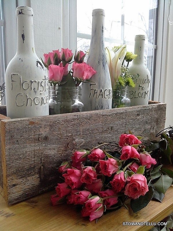 Antiqued wine bottle centerpiece