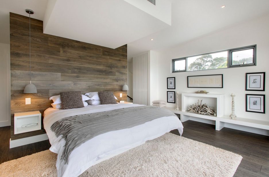 Wood floor on wall above the bed