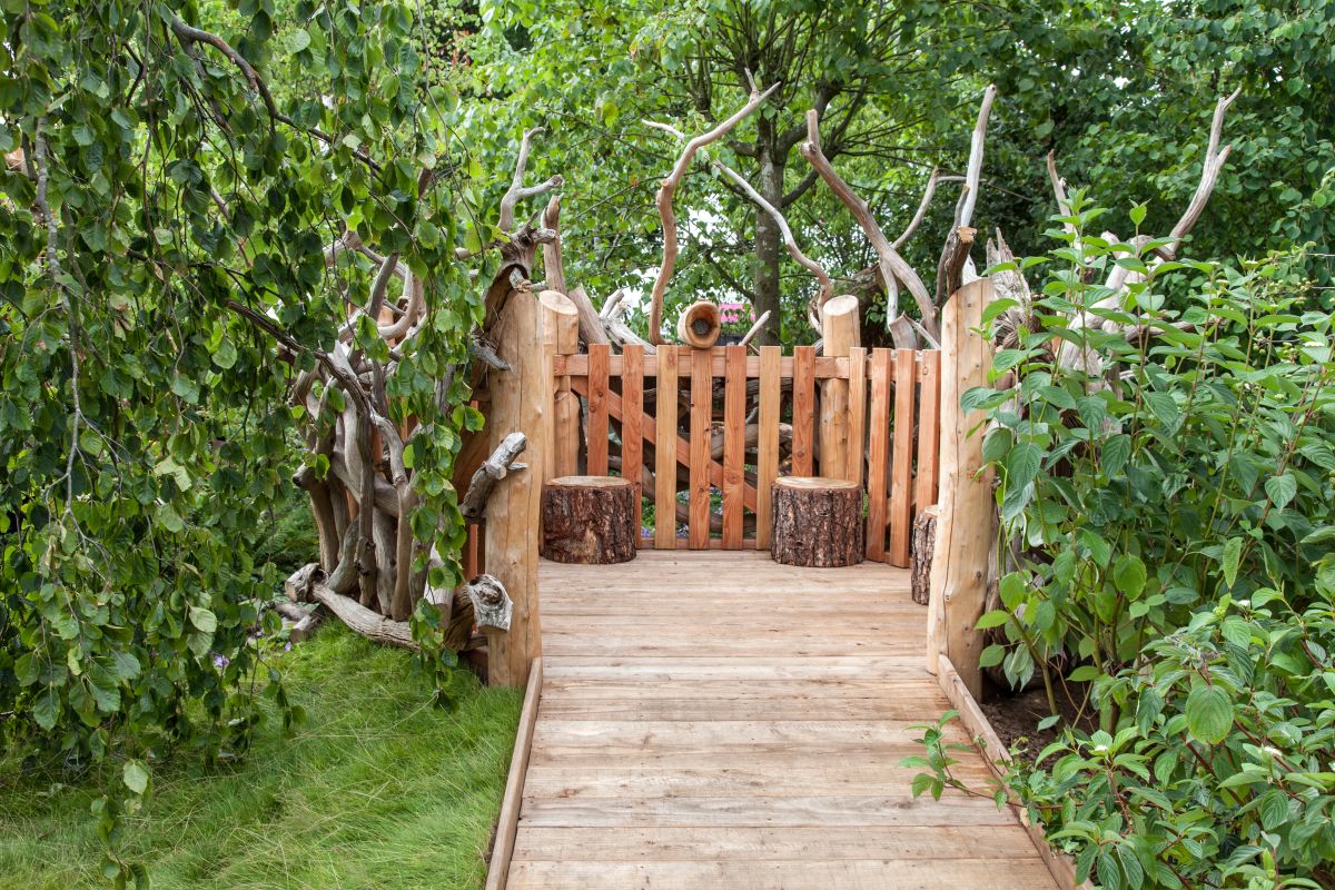 Place a bench at the end of a path and surround it with a low fence, like a sort of gazebo but with no roof