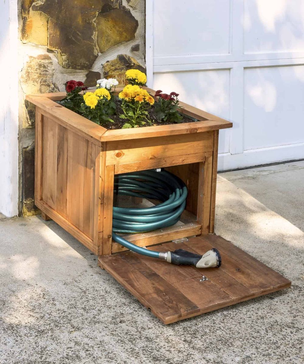 Wood planter with hose holder