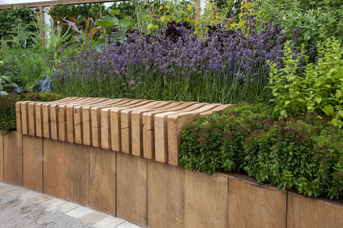 Plant some lavender around the garden bench. It smells lovely and it's also relaxing