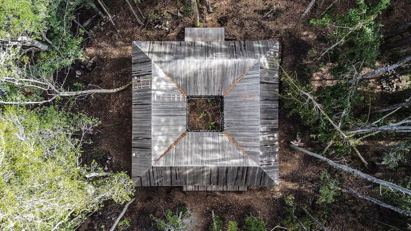 Wooden cabin on a remote site in the woods house