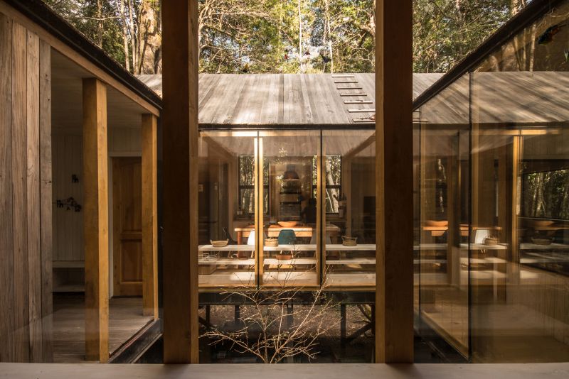 Wooden cabin on a remote site in the woods windows