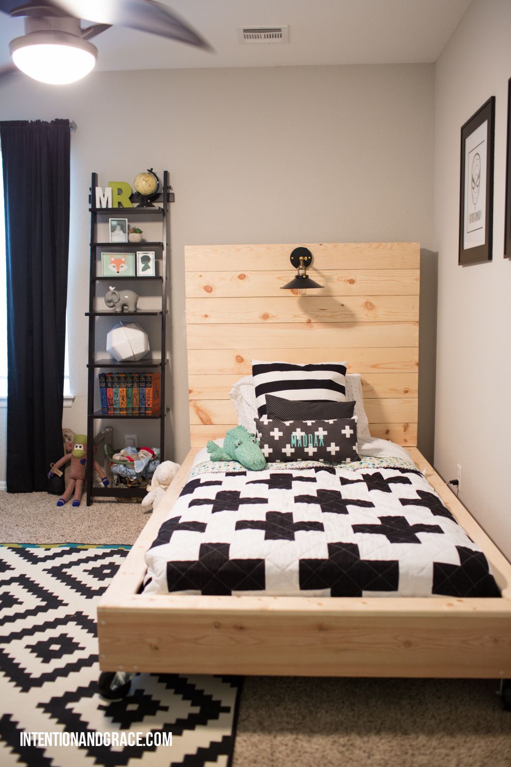 Wooden toddler bed on casters