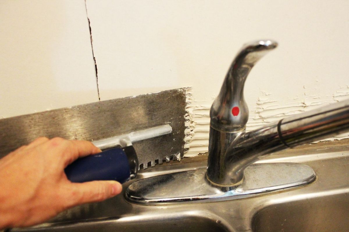Working behind the kitchen faucet
