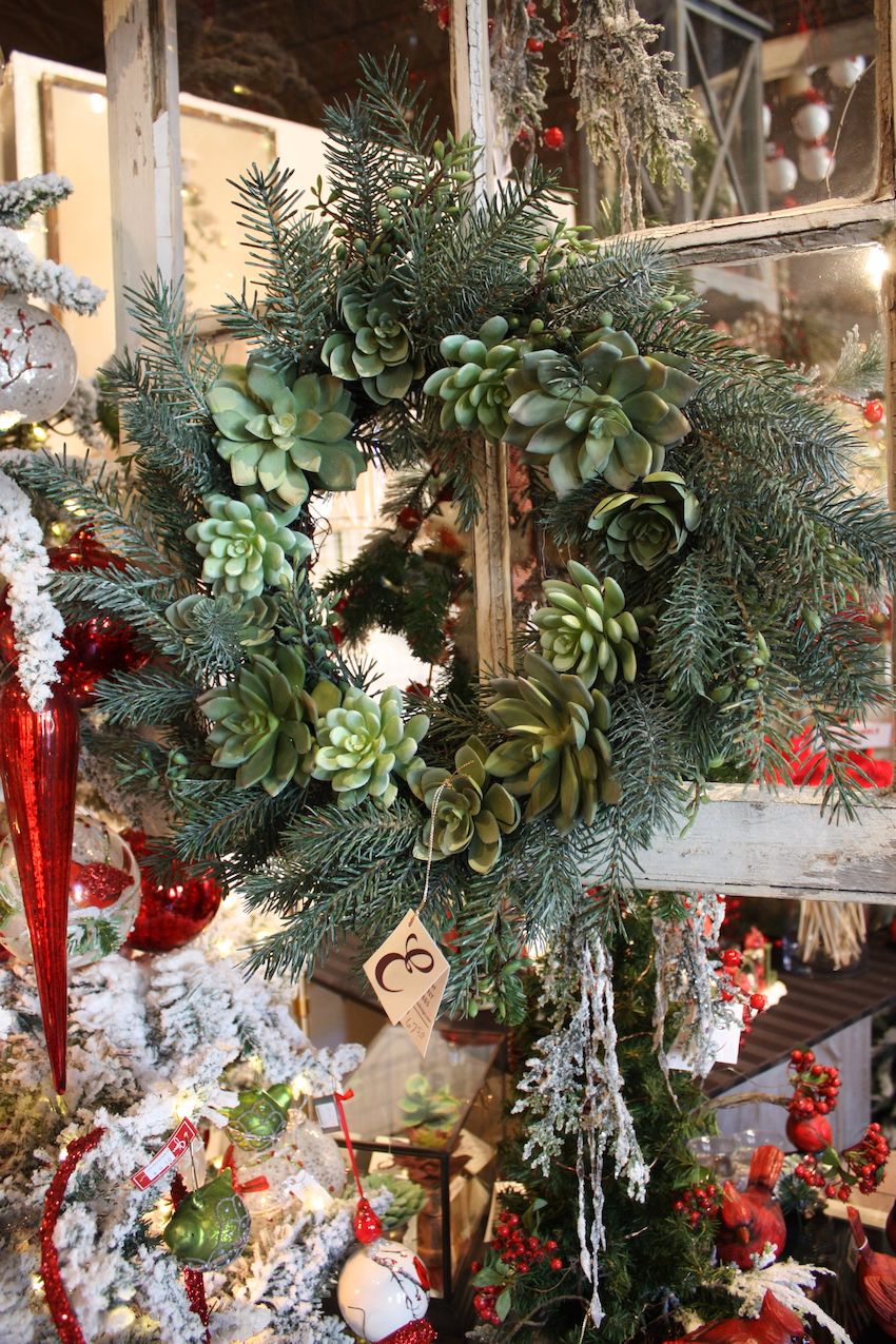 Combining traditional greenery with an unusual type of plant creates a distinctive wreath.
