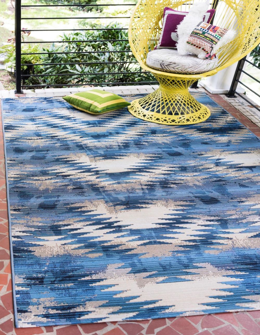 Yellow chair and blue rug for outdoor patio