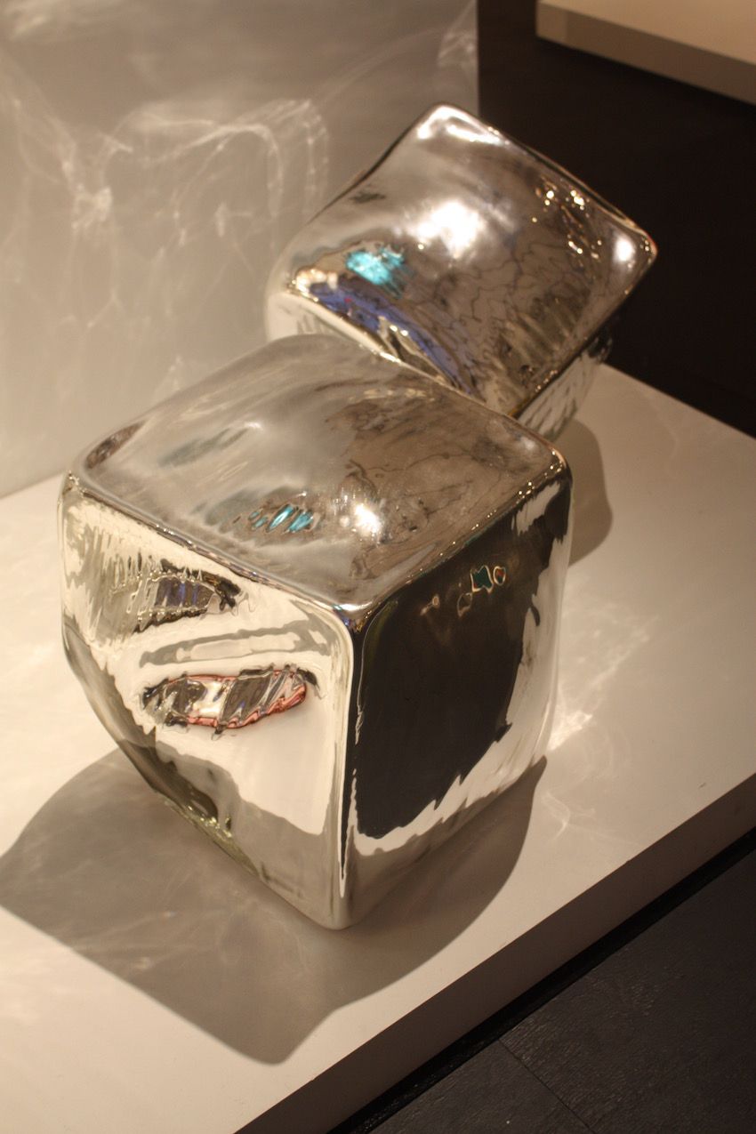 Zimmerman's cubes shimmer, reflecting light like pools of liquid.