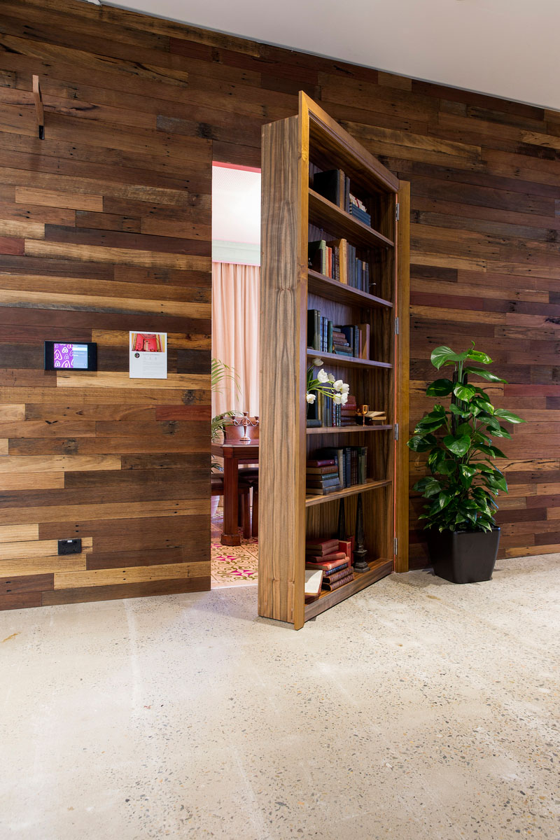 airbnb-sydney office interior design with hidden doors - bookcase