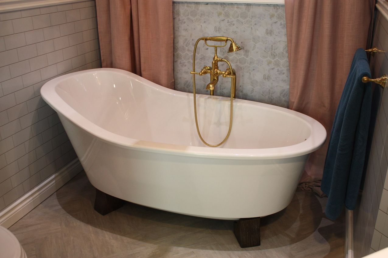 American standard freestanding tub with gold faucet