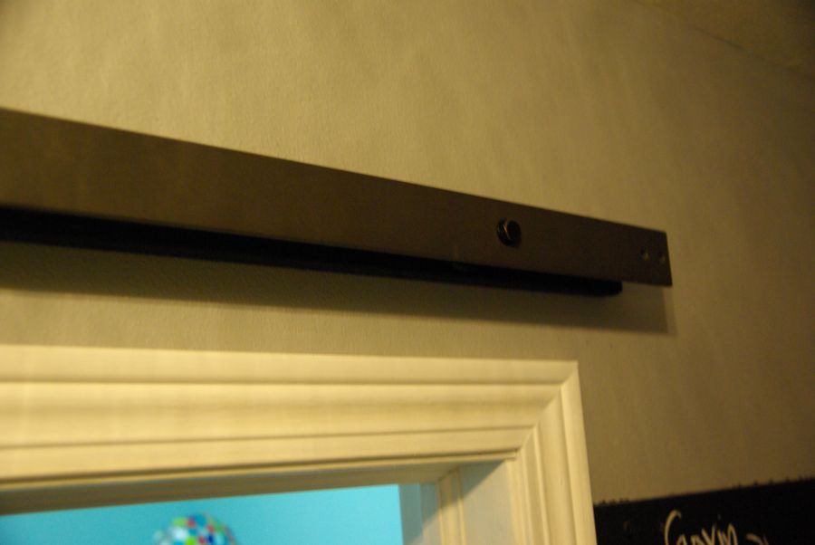 Barn door hardware attaching