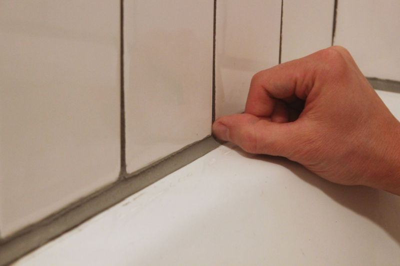 Bathroom caulk finger nail