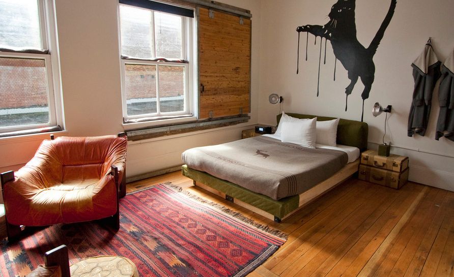 Bedroom featuring a wooden barn sliding for window