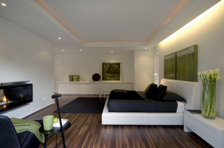 Bedroom with hardwood flooring and white furniture
