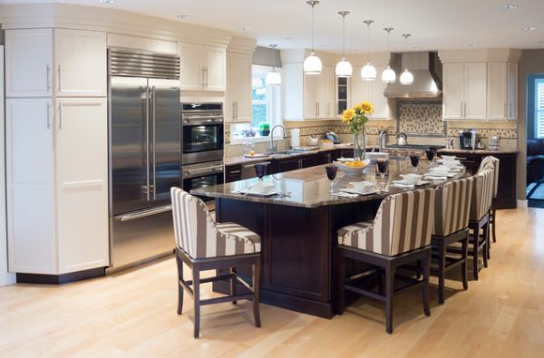 A long kitchen island can also become a dining table for casual guests