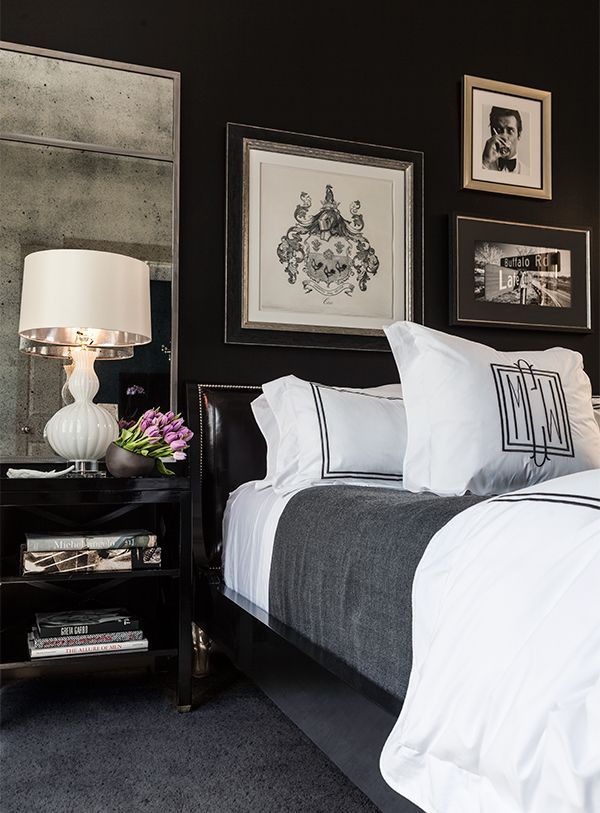 Brighten Up A Black and White Bedroom Space With Mirrors, Lamps, And Artwork