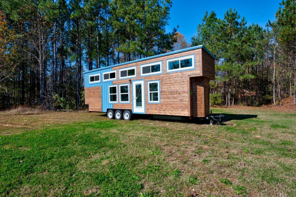 Blue and wood tiny house on wheels 1024x681