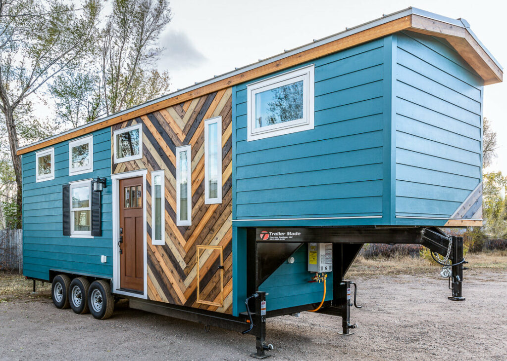 Blue eclectic tiny house on wheels 1024x731