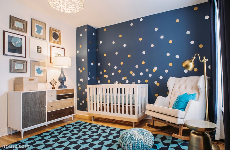 Blue wall nursery room with polka dots