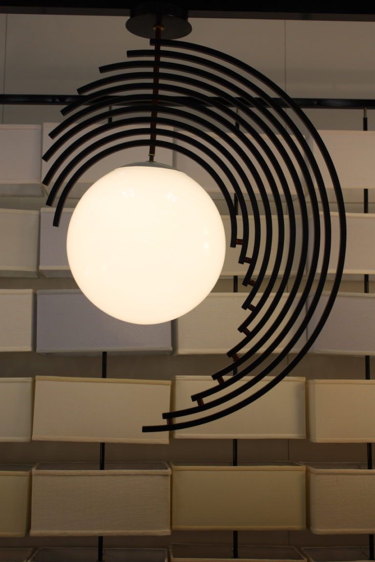 The partial rings around the globe shade are an atypical construct for the fixture.