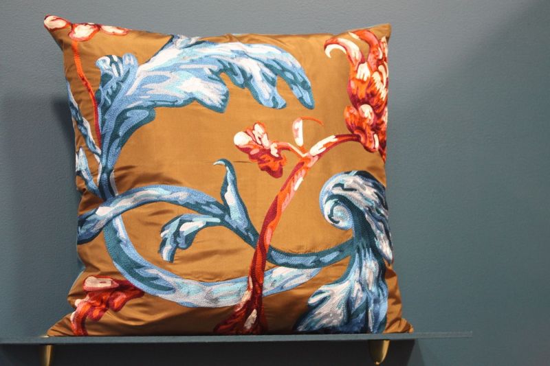 A traditional style motif gets a modern new life on a brightly colored background. We'd love to see this pillow as an accent in a room with modern decor.