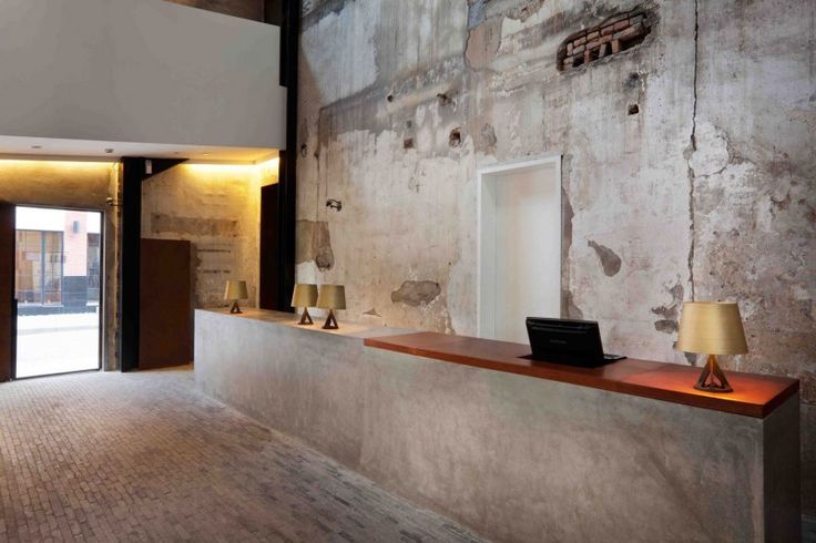 Concrete reception desk with wood on top