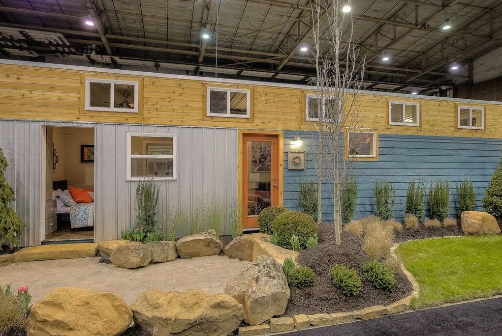 Container home blue with yard