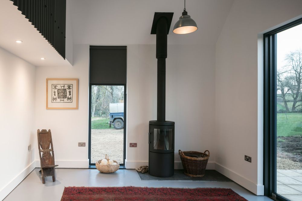 Corrugated metal extension eastabrook architects fire place