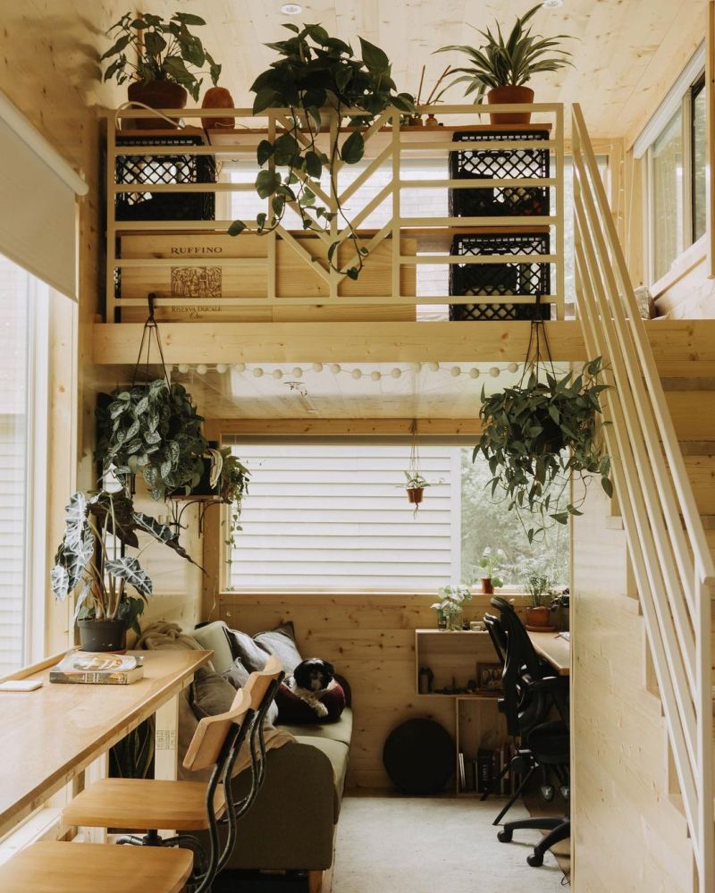 The area underneath the loft has a corner desk and a cozy lounge nook